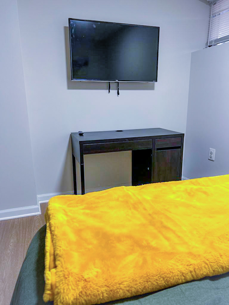 Room F desk and TV setup