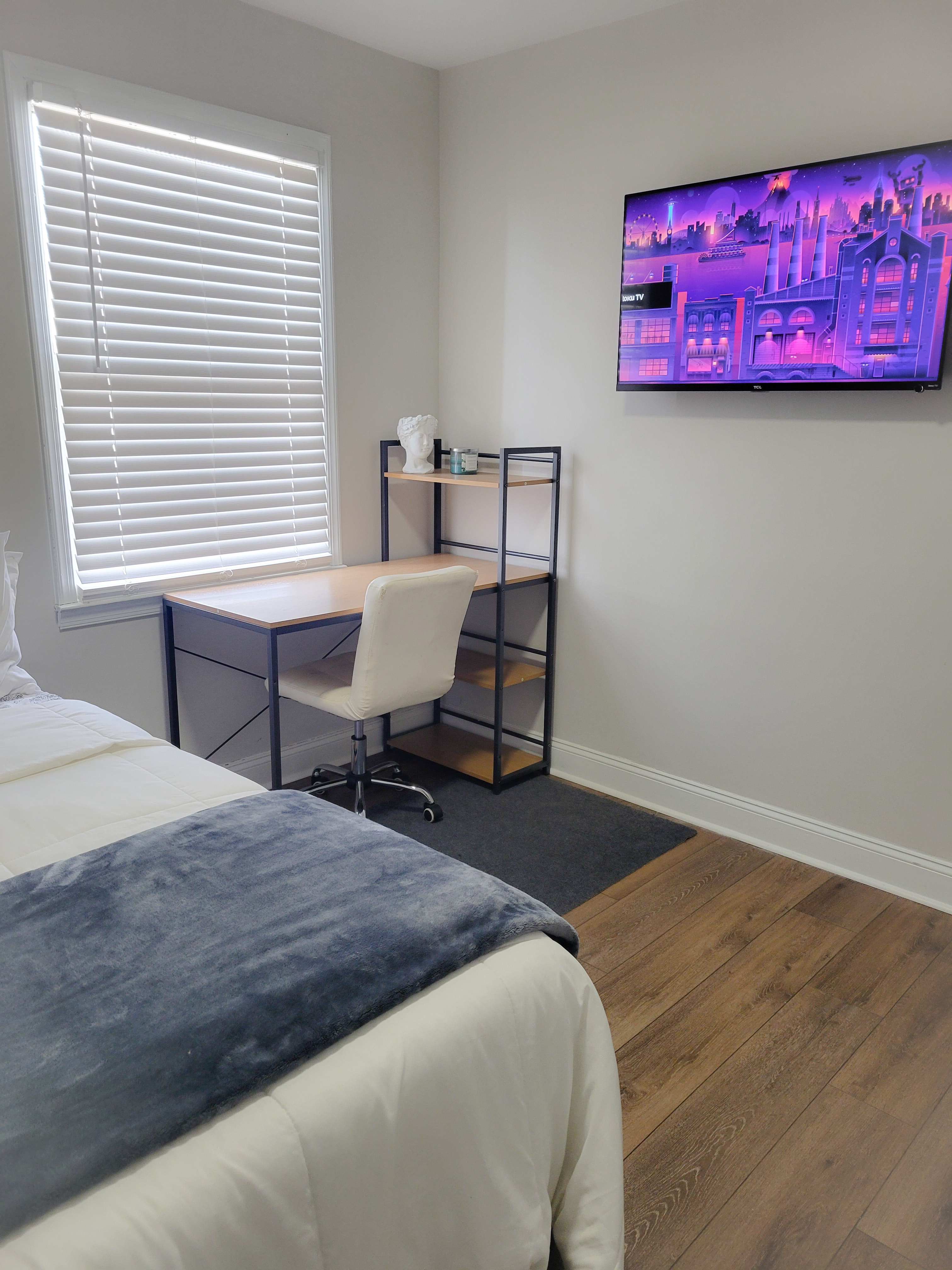 Room A desk and wall-mounted Smart TV